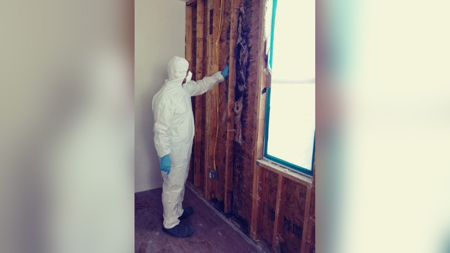 Sgt. 1st Class Jesus Joseph Brown, who joined eight other military families in suing Lendlease at Fort Hood, inspecting mold in his home.