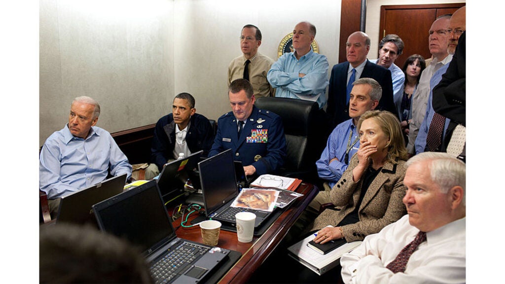 President Barack Obama and Vice President Joe Biden, along with members of the national security team, receive an update on Operation Neptune's Spear, a mission against Osama bin Laden, in one of the conference rooms of the Situation Room of the White House, May 1, 2011. They are watching live feed from drones operating over the bin Laden complex. (Pete Souza / Official White House Photographer)