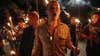 In this photo taken Friday, Aug. 11, 2017, multiple white nationalist groups march with torches through the UVA campus in Charlottesville, Va. Hundreds of people chanted, threw punches, hurled water bottles and unleashed chemical sprays on each other Saturday after violence erupted at a white nationalist rally in Virginia. (Mykal McEldowney/The Indianapolis Star via AP)