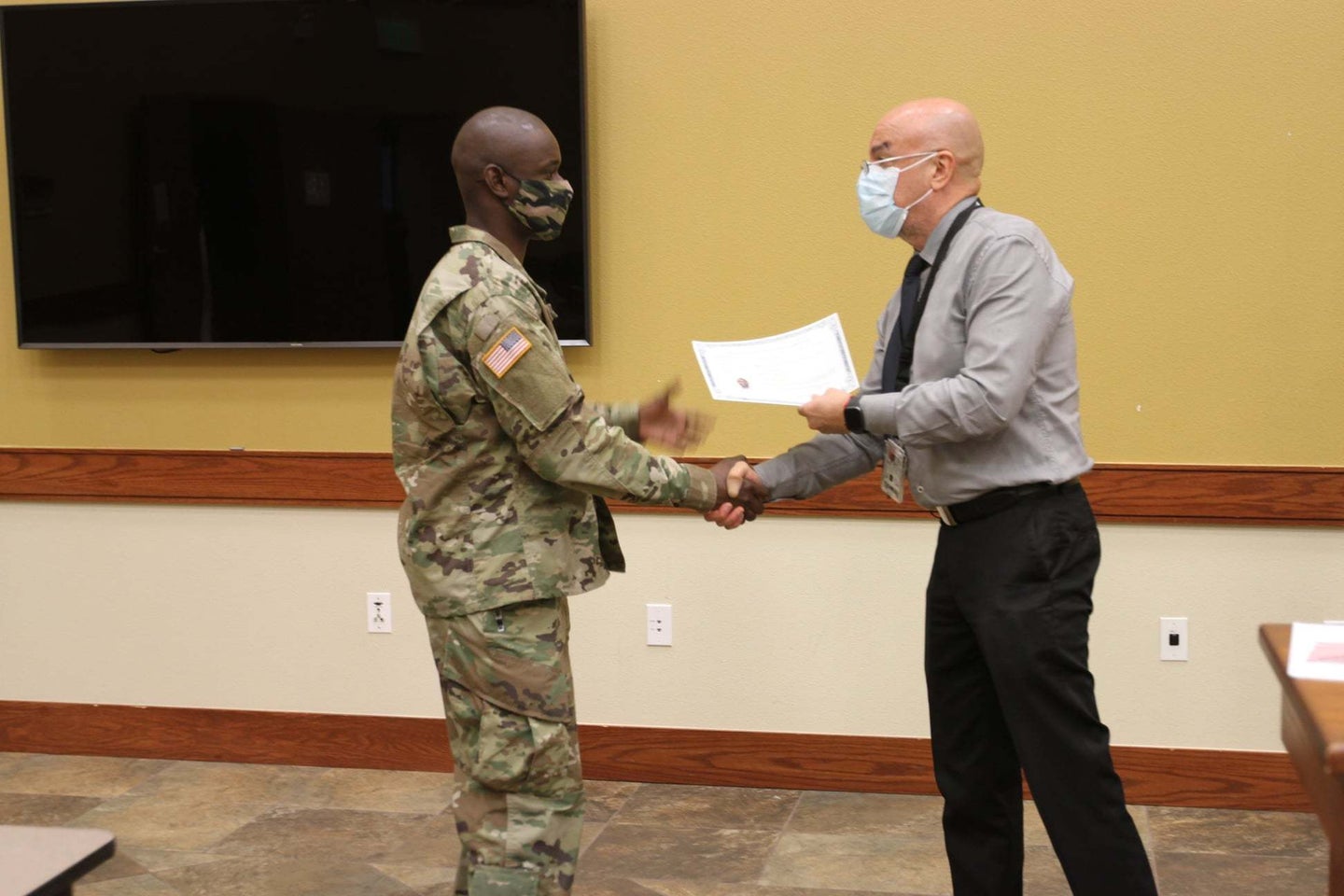 A First Team Trooper assigned to A Co., 1st Squadron, 8th Cavalry Regiment, 2nd Brigade, 1st Cav. Div., earned his citizenship during a ceremony held here, Oct. 20, 2020. Surrounded by his platoon, Spc. Omar Sey officially became an American citizen.