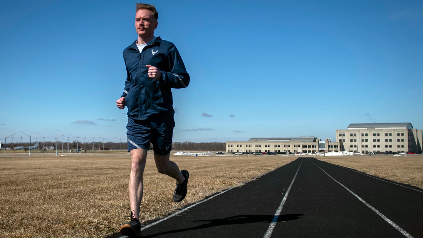 Air Force Uniform Office member 2nd Lt. Maverick Wilhite puts parts of the updated Air Force physical training (PT) uniform through their paces at Wright-Patterson Air Force Base, Ohio, Feb. 25, 2021. (U.S. Air Force photo by Jim Varhegyi)