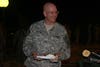 Brig. Gen. Gregg Martin goes down the chow line during Sapper Call, Sept. 27, 2008. Martine is one of many general officers that came out to the 926th's Sapper Call. The 926th Engineer Brigade of Montgomery, Ala., hosted the monthly event at their Headquarters and Headquarters Company 'goat house.'