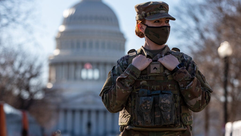 U.S Army Cpl. Jessica McHenry, a military police officer with the 135th Military Police Company, Ohio National Guard, stands watch near the U.S. Capitol in Washington, March 3, 2021.  The National Guard has been requested to continue supporting federal law enforcement agencies with security, communications, medical evacuation, logistics, and safety support to district, state, and federal agencies through mid-March. (U.S. Army National Guard photo by Sgt. 1st Class R.J. Lannom Jr.).