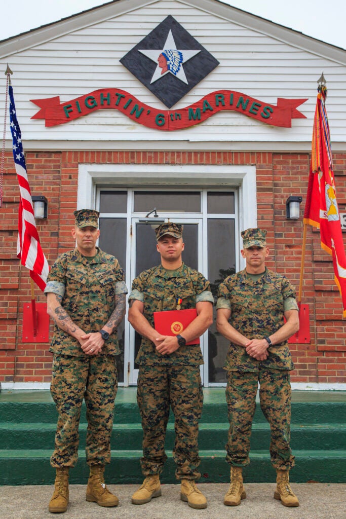 U.S. Marine Corps Sgt. Maj. Daniel Krause, Sgt. Maj. Anthony Loftus and Sgt. Danny McDonald, all with 2d Marine Division, pose for a photo after a Navy and Marine Corps Medal award ceremony at Camp Lejeune, N.C., March 17, 2021. McDonald was awarded for his selfless actions in Surf City, N.C., May 4, 2019, where he risked his own life to save a 10-year-old child from drowning. The child was caught in a rip current that carried him approximately 300 feet from shore.(U.S. Marine Corps photo by Cpl. Elijah Abernathy)