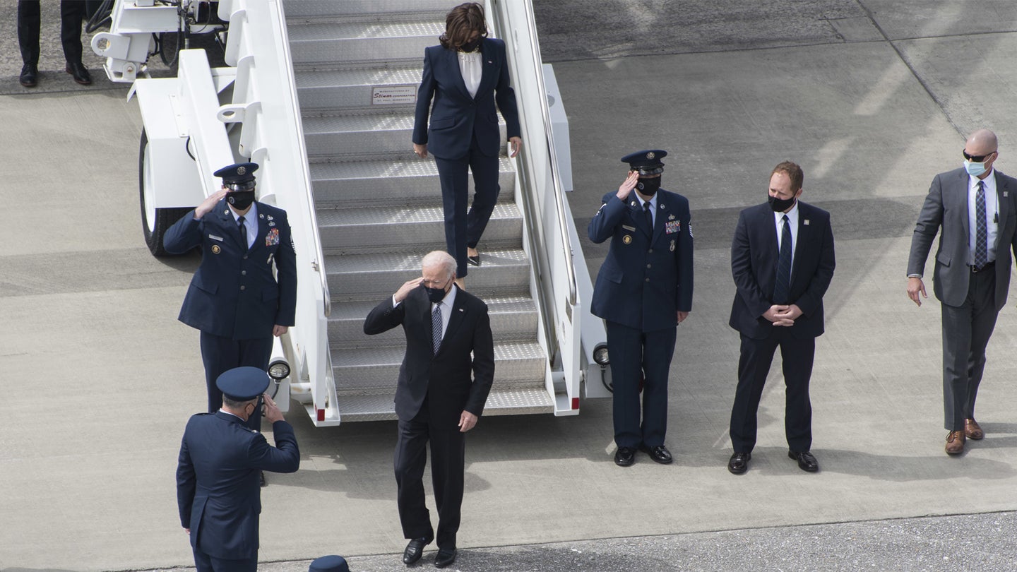 President Joe Biden returns a salute as he and Vice President Kamala Harris disembark Air Force One after a brief meeting aboard the aircraft parked at Dobbins Air Reserve Base, Ga. March 19, 2021. The president and vice president were greeted by Col. Craig McPike, 94th Airlift Wing commander, and Chief Master Sgt. Vicki Robertson, 94th AW command chief. (U.S. Air Force photo/Andrew Park)