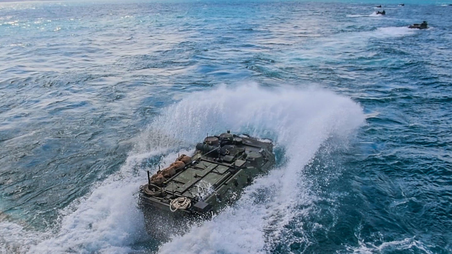 An amphibious assault vehicle (AAV) assigned to Combat Assault Battalion AAV Company, splashes into the water from the well deck of the amphibious dock landing ship USS Ashland (LSD 48) during an amphibious assault as part of Blue Chromite. Blue Chromite (U.S. Navy photo by Mass Communication Specialist 3rd Class Jonathan Clay)