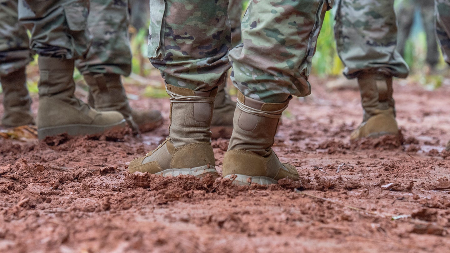 Combat boots in the mud.