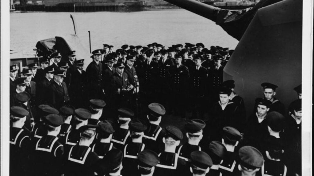 Then-Lt. Cmdr. Ernest E. Evans addresses Johnston’s officers and men at her commissioning, 27 October 1943. (Navy photo)