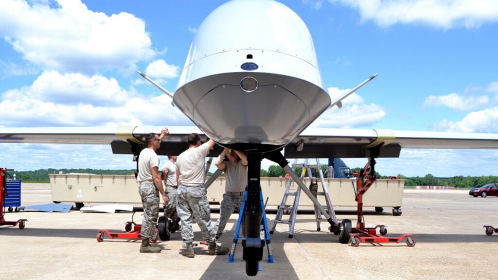 An aircraft maintenance team from the 174th Attack Wing out of Syracuse, N.Y., assemble a static display General Atomics MQ-9 Reaper on June 6, 2014 at Horsham Air Guard Station. The non-functioning aircraft was trucked in and assembled in advance of the re-designation ceremony of the 111th Attack Wing and the 90th anniversary of the 103rd Fighter Squadron. The 103rd as well was renamed the 103rd Attack Squadron. (U.S. Air National Guard photo by Master Sgt. Christopher E. Botzum/Released)