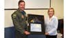 Pennsylvania State Senator, Maria Collett (PA-District 12), presents Col. William Griffin, commander of the 111th Attack Wing, a Pennsylvania Commonwealth flag in honor of the unit receiving the 2018 Outstanding Unit Award by the United States Air Force at Horsham Air Guard Station, Pennsylvania on May 4, 2019. (U.S. Air National Guard photo by Master Sgt. Chris Botzum)