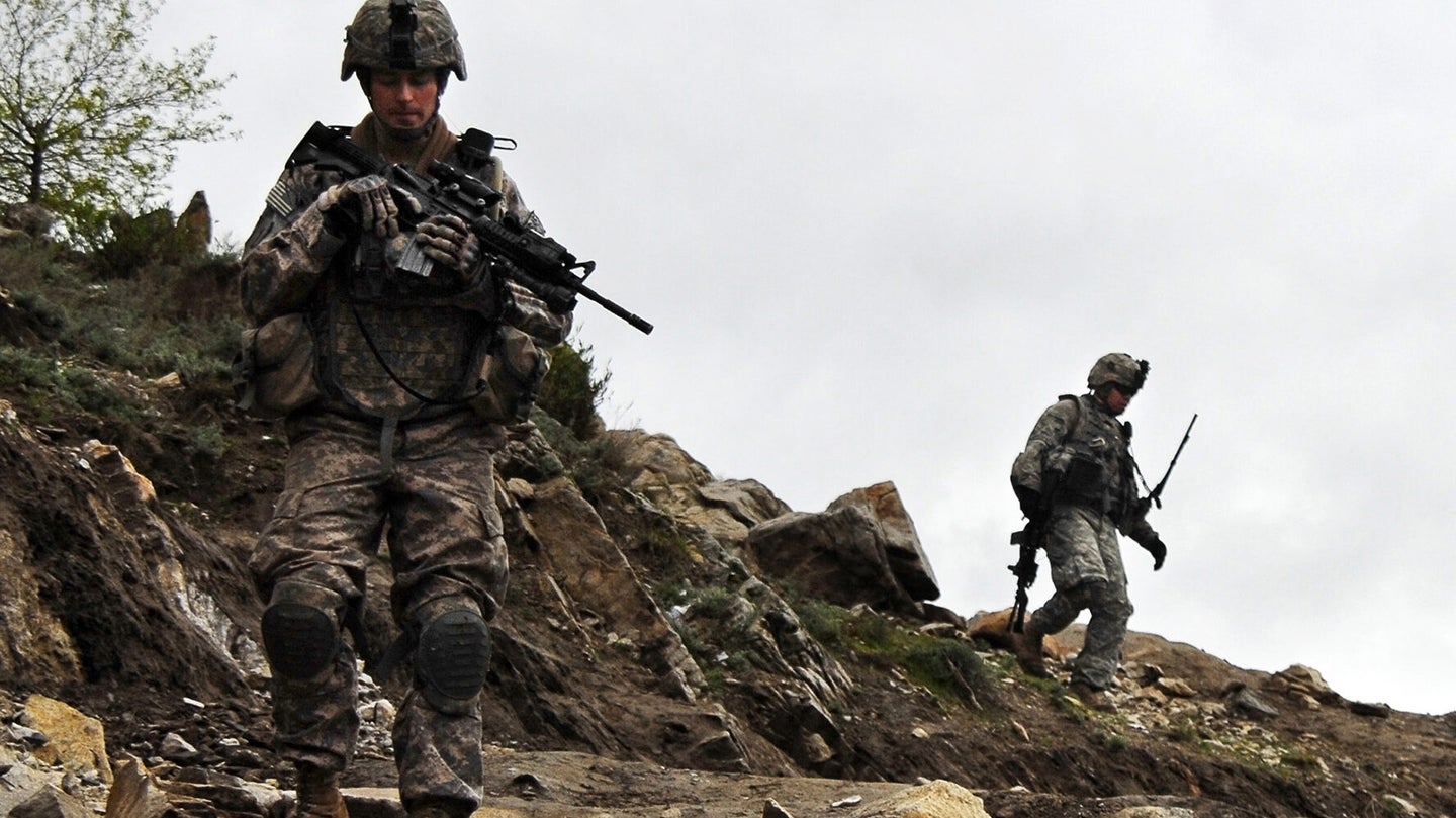 Soldiers from C. Company, 1st Battalion, 26th Infanry Regiment, 1st Infantry Division, patrol the Waygul Valley's rocky cliffs, near the village of Walo Tangi, in Konar province, Afghanistan, April 6.