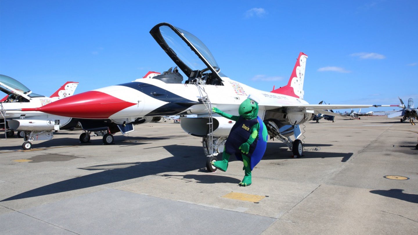 (Sept. 20, 2019) Stewie, the U.S. Navy’s environmental mascot, poses with an F-16 Fighting Falcon aircraft from the U.S. Air Force Air Demonstration Squadron, “Thunderbirds,” today at the 2019 Oceana Air show. (Navy photo by Mass Communication Specialist 1st Class Gary A Prill)