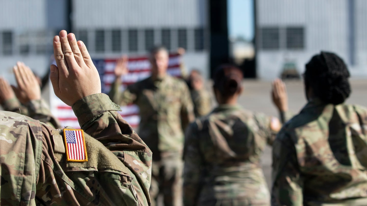Gen. Joseph Martin, 37th Vice Chief of Staff of the U.S. Army, leads a reenlistment ceremony of 3rd Infantry Division Soldiers as they raise their right hands and volunteer to continue their Army service on Hunter Army Airfield, Georgia, March 10. (U.S. Army/Sgt. Andrew McNeil)