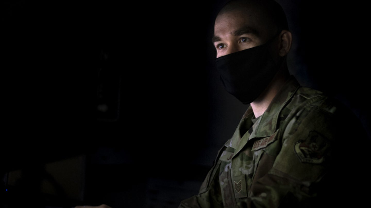 U.S. Air Force Tech. Sgt. Caleb Jones, 386th Expeditionary Force Support Squadron manpower analyst, uses a computer at Ali Al Salem Air Base, Kuwait, May 12, 2021. Jones, with the help several other individuals, created a macro, a recorded series of instructions, within an spreadsheet that eliminates approximately 37 work-hours for unit travel representatives. (U.S. Air Force photo by Senior Airman Taryn Butler)