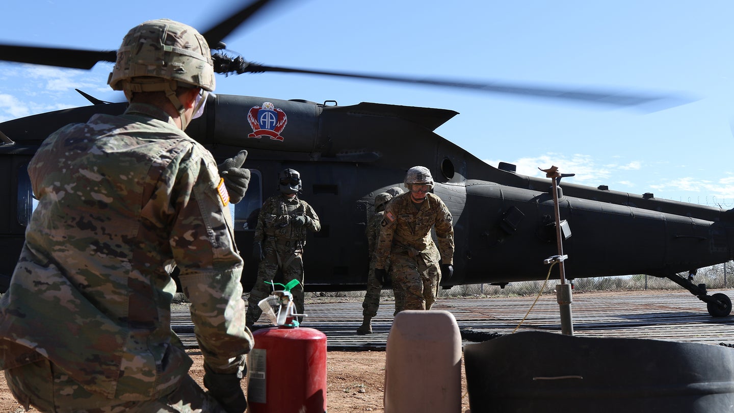 Soldiers from 227th Composite Supply Company, 101st Airborne Division, rush to refuel a UH60 Blackhawk in between aerial support missions in Sasabe, Arizona, Nov. 20, 2018. U.S Northern Command is providing military support to the Department of Homeland Security and U.S. Customs and Border Protection to secure the southern border of the United States. (U.S. Army photo by Sgt. Kyle Larsen)