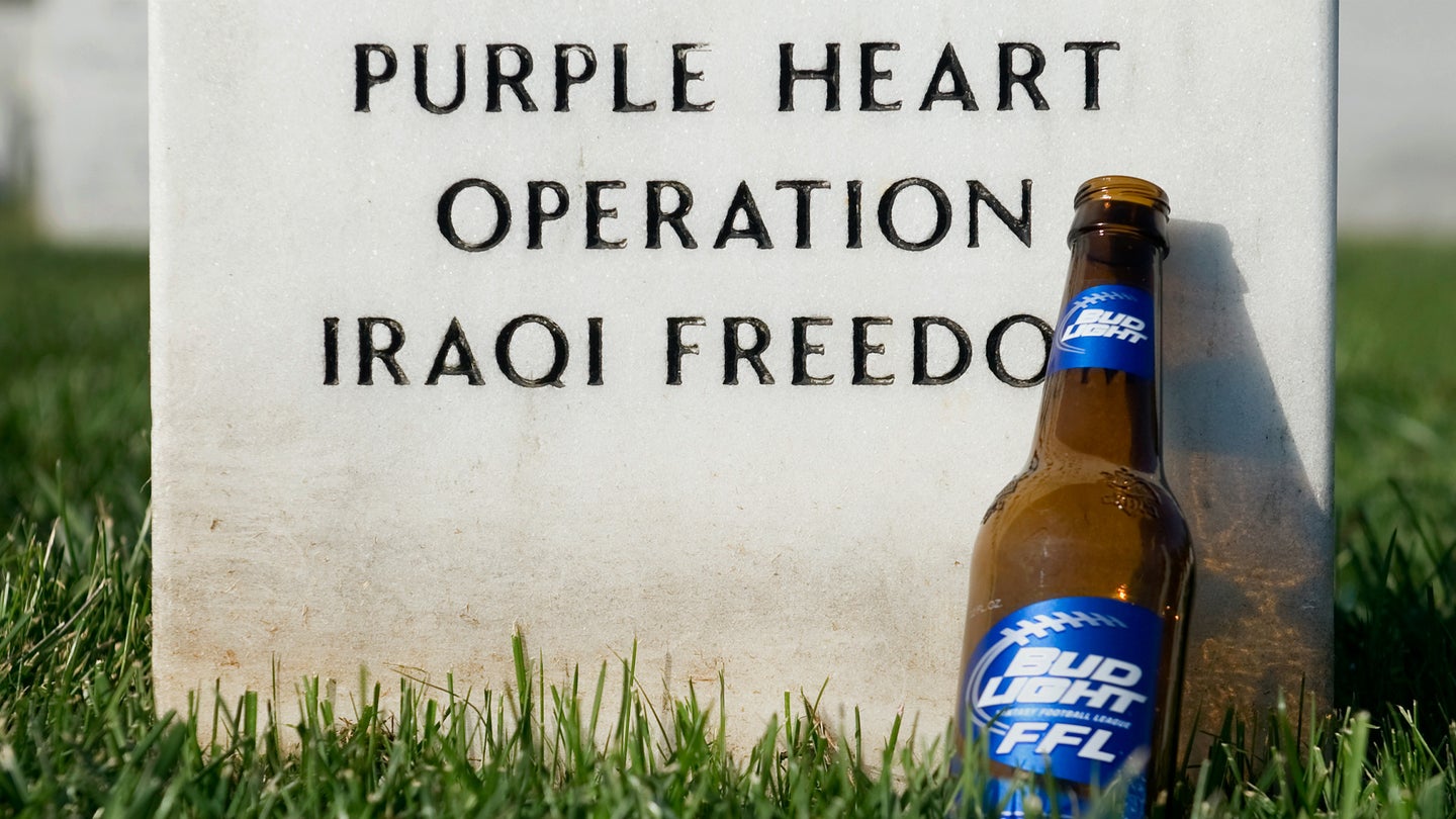 A beer bottle left at the grave of Marine Lance Cpl. Robert Mininger in Section 60 at Arlington National Cemetery. (Chris Maddaloni/CQ Roll Call via AP Images)