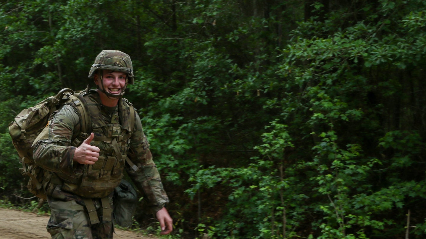 Cpl. Joseph Massey, an infantryman assigned to 1st Battalion, 28th Infantry Regiment, 3rd Infantry Division, strikes a pose as he competes in a foot march at Fort Stewart, Georgia, May 5, 2021. Massey was the first to finish the 12-mile foot march for the 3rd Infantry Division Soldier and Noncommissioned Officer of the Year Competition. (Spc. Jose Escamilla/U.S. Army)