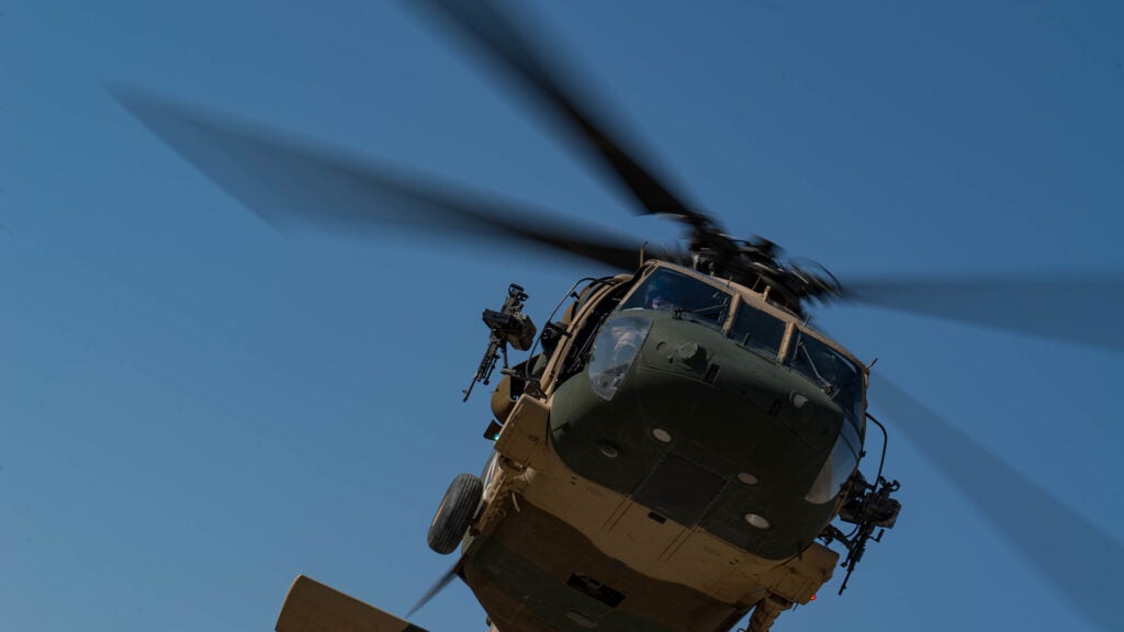 An Afghan Air Force UH-60A Black Hawk assigned to the 2nd Wing Afghan Air Force, conducts dust off landing practice on Dec. 10, 2018, as a part of Train, Advise and Assist Command-Air's (TAAC-Air) mission at Kandahar Airfield, Afghanistan. The mission of TAAC-Air is to train, advise and assist Afghan partners to develop a professional, capable and sustainable Afghan Air Force. (U.S. Air Force photo/Senior Airman Maygan Straight)