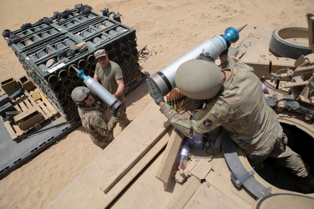 U.S. Army Soldiers assigned to 1st Battalion, 194th Armor Regiment, 1st Brigade Combat Team, 34th Infantry Division, load ammunition into their M1 Abrams Main Battle Tank, May 3, 2021, at Udairi Range Complex, Kuwait. The main gun of the M1 Abrams MBT shoots a 105 mm round before firing on the zero range to ensure their weapons were ready for their upcoming mission, Operation Phantom Steadfast. The unit reports to Task Force Spartan while deployed in Southwest Asia. (U.S. Army Photo by Spc. Juan Carlos Izquierdo, U.S. Army Central Public Affairs)
