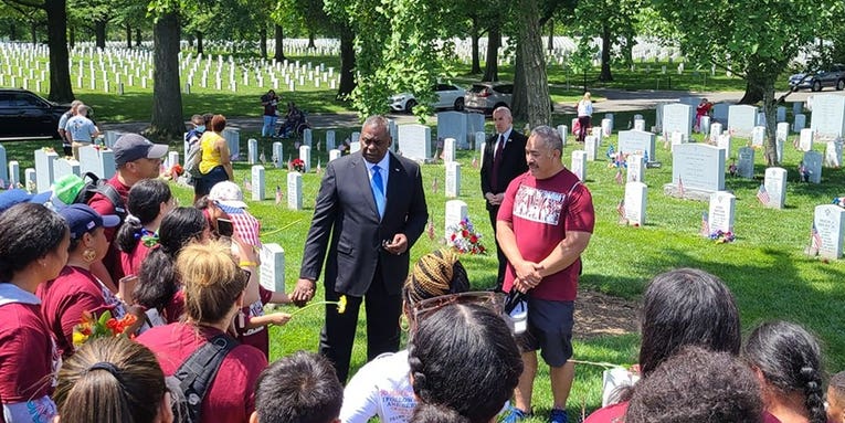 The story behind a viral video of Defense Secretary Lloyd Austin surprising a group laying wreaths at Arlington Cemetery