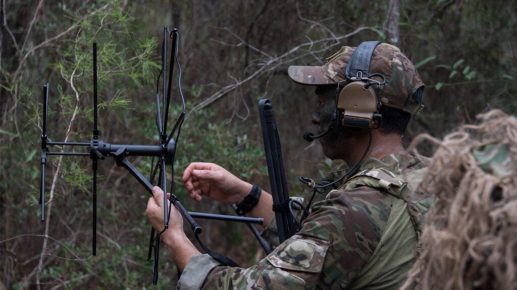 A U.S. Air Force Special Tactics operator sets up satellite communications during a full mission profile as part of a beta Special Reconnaissance course near Hurlburt Field, Florida, Sept. 25, 2019. The Special Tactics Training Squadron conducted the course to identify specific core tasks required for each skill level of the new SR career field. (U.S. Air Force photo by Staff Sgt. Rose Gudex)