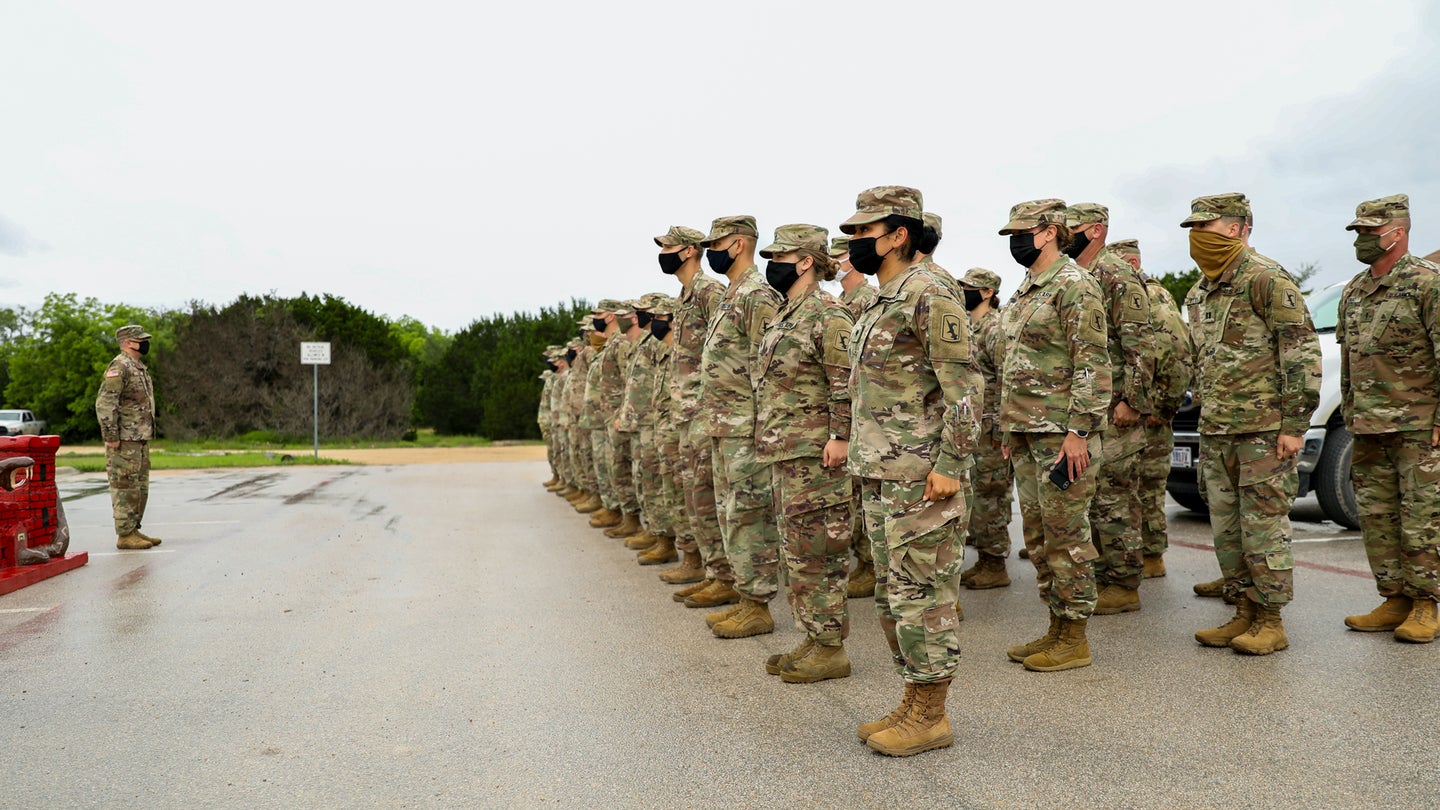 Capt. Roger Yant, company commander, addresses Soldiers with the Nebraska Army National Guard’s Headquarters and Headquarters Company, 67th Maneuver Enhancement Brigade, standing in formation prior to a promotion ceremony, May 23, 2021, during pre-deployment training at Fort Hood, Texas. The brigade is preparing for an overseas deployment to the Horn of Africa. (U.S. Army National Guard photo by Sgt. Lisa Crawford)
