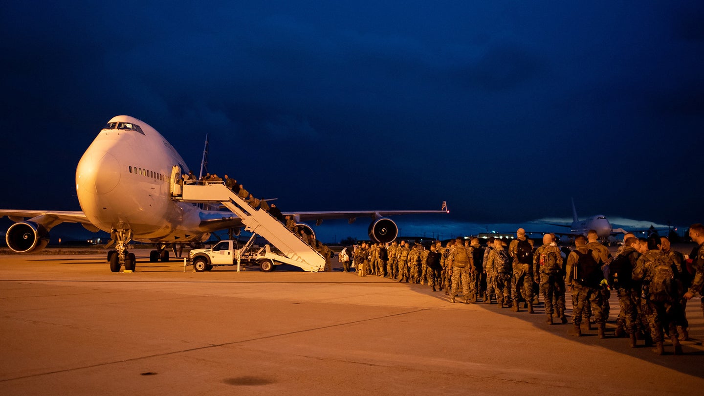 Airmen from the 388th and 419th Fighter Wings file onto a 747 at Hill Air Force Base, Utah, bound for the Middle East to support the F-35A Lightning II’s first deployment there. (U.S. Air Force photo by R. Nial Bradshaw)