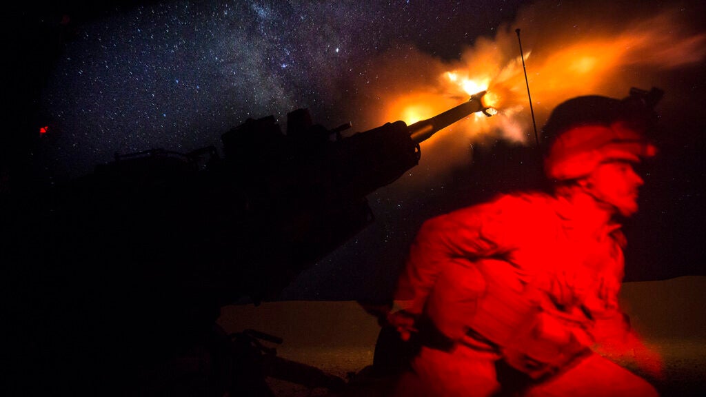 FILE PHOTO: A U.S. Marine fires an M777-A2 Howitzer in the early morning in Syria, June 3, 2017. (U.S. Marine Corps photo by Sgt. Matthew Callahan)