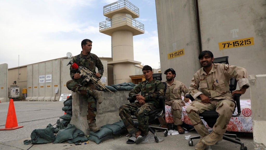 Afghan security forces keep watch after the American military left Bagram air base, in Parwan province north of Kabul, Afghanistan, Monday, July 5, 2021. The U.S. left Afghanistan's Bagram Airfield after nearly 20 years, winding up its "forever war," in the night, without notifying the new Afghan commander until more than two hours after they slipped away. (AP Photo/Rahmat Gul)