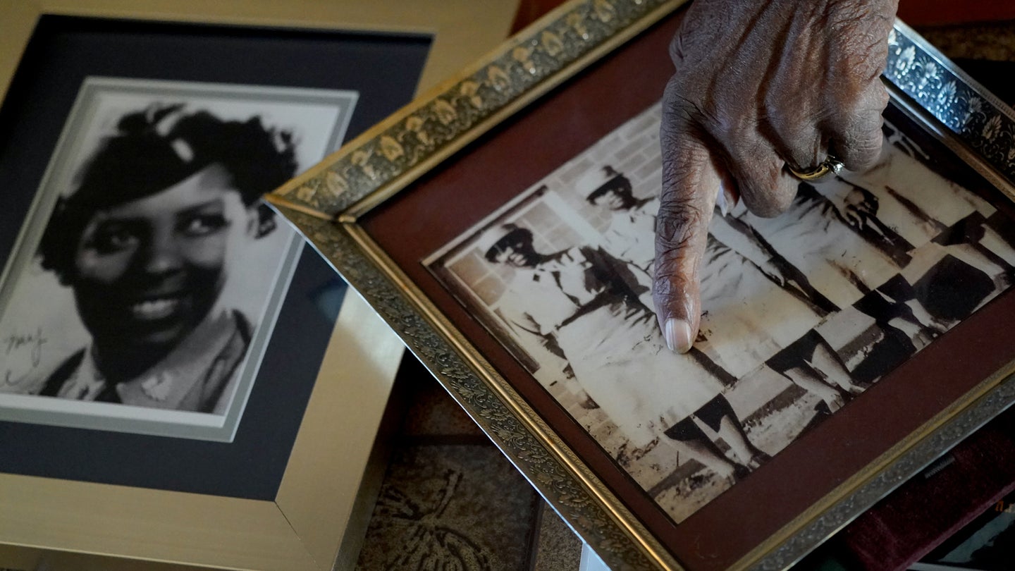 World War II veteran Maj. Fannie Griffin McClendon shows images of herself during her time in the military, Thursday, June 10, 2021, at her home in Tempe, Ariz. McClendon had a storied history as a member of the 6888th Central Postal Directory Battalion that made history as being the only all-female, black unit to serve in Europe during World War II. (AP Photo/Matt York)