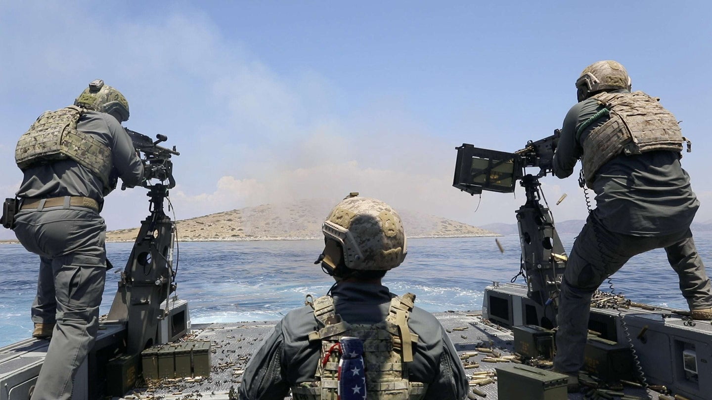 Two U.S. Navy Special Warfare Combatant-Craft Crewmen assigned to Naval Special Warfare engage a target during a joint live-fire training exercise with Hellenic Navy operators from the Underwater Demolition Command (DYK) in the Aegean Sea near Greece on July 16, 2020. (U.S. Army photo by Sgt. Aven Santiago)
