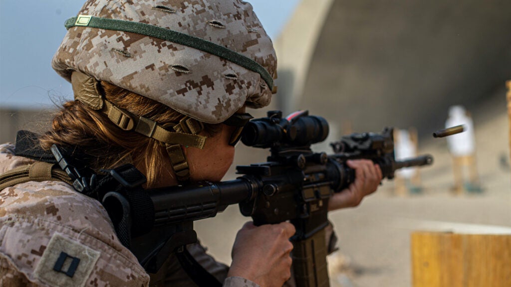 A U.S. Marine Corps Female Engagement Team (FET) member assigned to Special Purpose Marine Air-Ground Task Force – Crisis Response – Central Command (SPMAGTF CR-CC) 21.1, engages her target during a range, in Kuwait, Apr. 28, 2021.