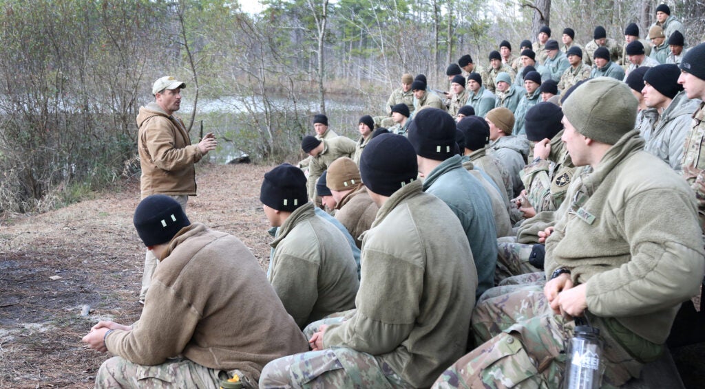 Mr. Jason Smith, instructor, teaches students from the U.S. Army John F. Kennedy Special Warfare Center and School field expedient fishing techniques during the survival phase of Survival Evasion Resistance and Escape Level-C training (SERE) at Camp MacKall, North Carolina, Jan. 15, 2019. Soldiers in SERE underwent intensive training in support of the Code of the Conduct, and were taught survival fieldcraft skills, techniques of evasion, resistance to exploitation and resolution skills so if captured, they can return with honor. (U.S. Army Photo by K. Kassens)