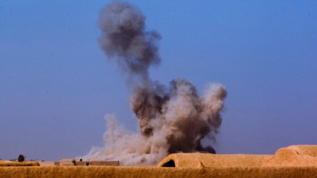 A mushroom cloud rises into the air following an airstrike on confirmed enemy positions during a patrol near Forward Operating Base Shir Ghazi, Helmand province, Afghanistan, Aug. 28, 2013. A nearby unit called in the airstrike while a convoy of Marines with Combat Logistics Regiment 2, Regional Command (Southwest), pushed north to conduct logistical operations.