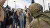 British army Soldier Cpl. Jamie Hart, 77th Brigade, 6th United Kingdom Division, captures photos of a simulated protest during Dragoon Ready 20 at the Joint Multinational Readiness Center, Hohenfels, Germany, Nov. 4, 2019. British Soldiers with the 77BDE use information warfare by specializing in civil affairs, public affairs, media and psychological operations to achieve mission success. (U.S. Army photo by Pfc. Michael Ybarra)