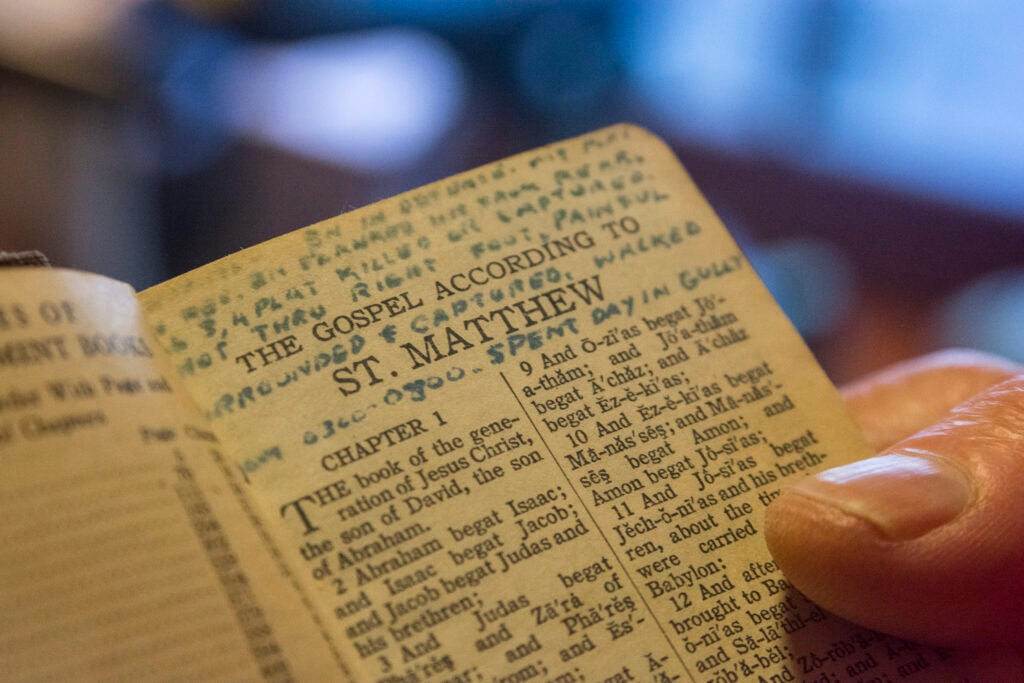 A close-up of a page in a Bible carried by (then) U.S. Army 1st Lt. William H. Funchess while he was a prisoner of war during the Korean War for 34 months, photographed in his home in Clemson, S.C. Sept. 21, 2016. He wrote on the page after his first night of captivity. It reads: “Battalion in defense. My platoon in rear. Battalion flanked and hit from rear. All 3rd and 4th platoons killed or captured. Shot through right foot. Painful. Surrounded and captured. Walked from 3am to 8am. Spent day in gulley. Walked all night.” Funchess was held in the same prison compound and became very close to Army Chaplain Father Emil J. Kapaun, who received the Medal of Honor posthumously in 2013 for his acts of courage and compassion as a prisoner of war. Funchess and Kapaun read from this Bible together on many occasions.  (U.S. Army photo by Staff Sgt. Ken Scar)