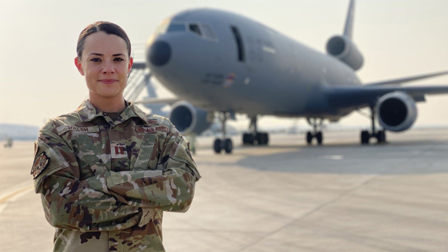 U.S. Air Force Capt. Erin Walsh, 380th Expeditionary Aircraft Maintenance Squadron officer in charge of the KC-10 Extenders, poses for a photo in front of an Extender at Al Dhafra Air Base, United Arab Emirates, Aug 6, 2021. (U.S. Air Force photo by Master Sgt. Wolfram M. Stumpf)