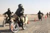 A group of Afghan National Army soldiers navigate around orange cones during their motorcycle training course held at Forward Operating Base Delaram II, Dec. 28, 2010.