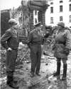 General Omar Bradley, General Dwight Eisenhower, and General George Patton, all graduates of West Point, survey war damage in Bastogne, Belgium (Army photo / National Archives)