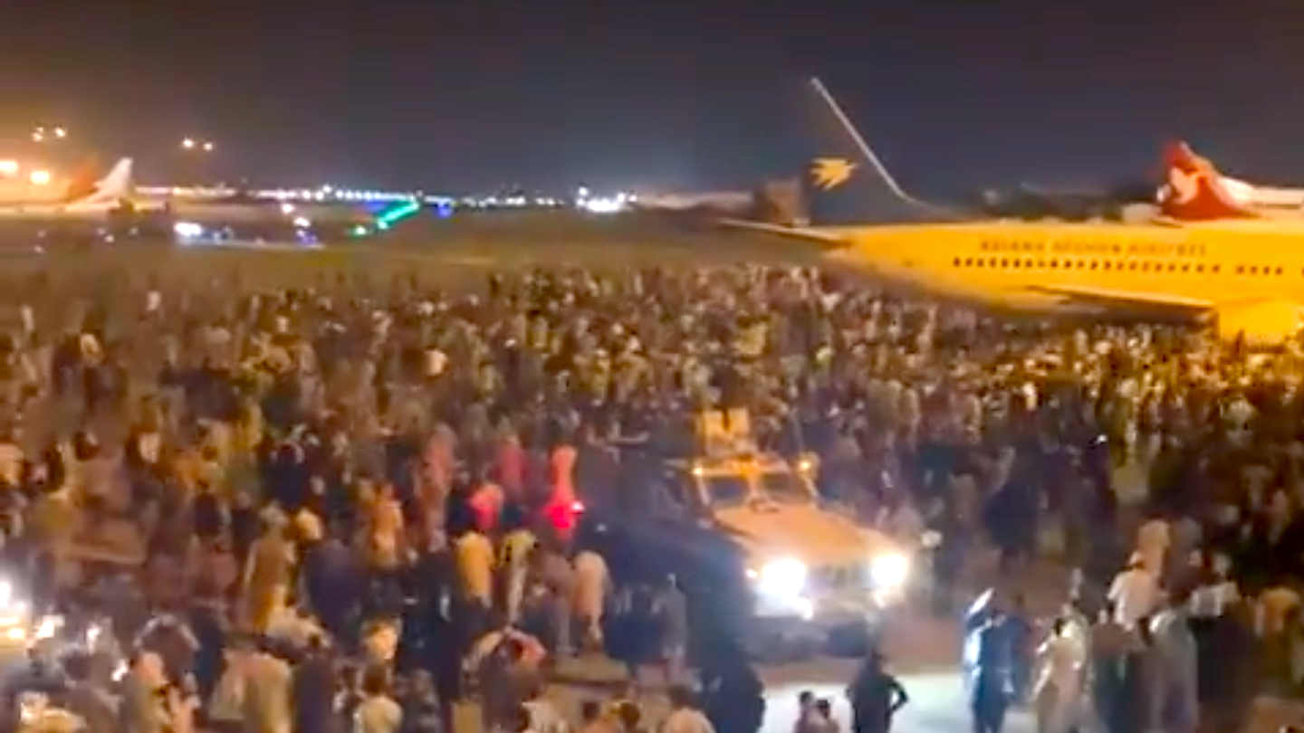 <em>Huge crowds gathered at the airport in Kabul</em>
