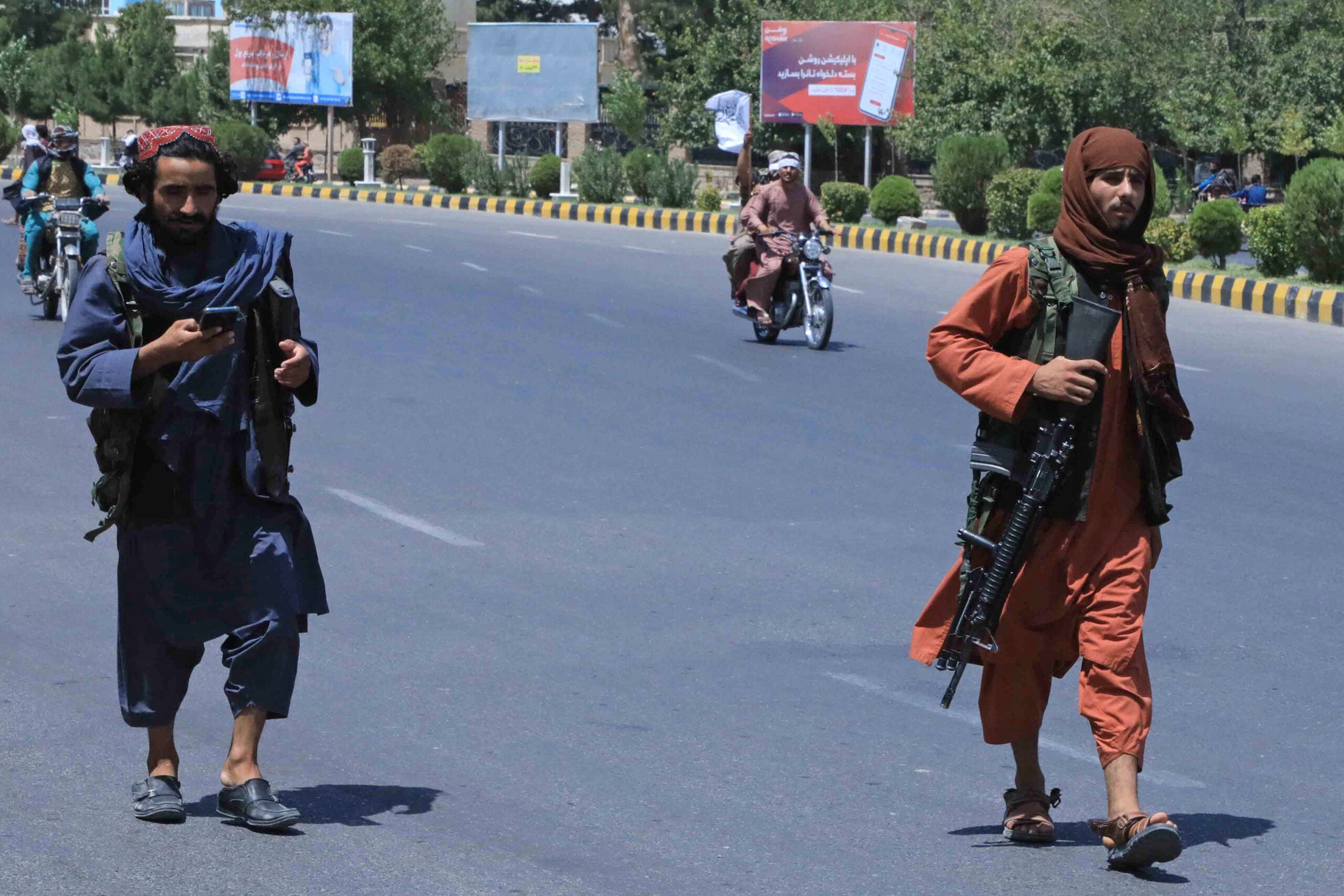 TOPSHOT - Taliban fighters patrol the streets in Herat on August 14, 2021. (Photo by - / AFP) (Photo by -/AFP via Getty Images)