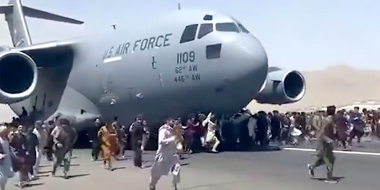 Afghans are literally clinging to the sides of US military aircraft to escape the Taliban sweep of Kabul
