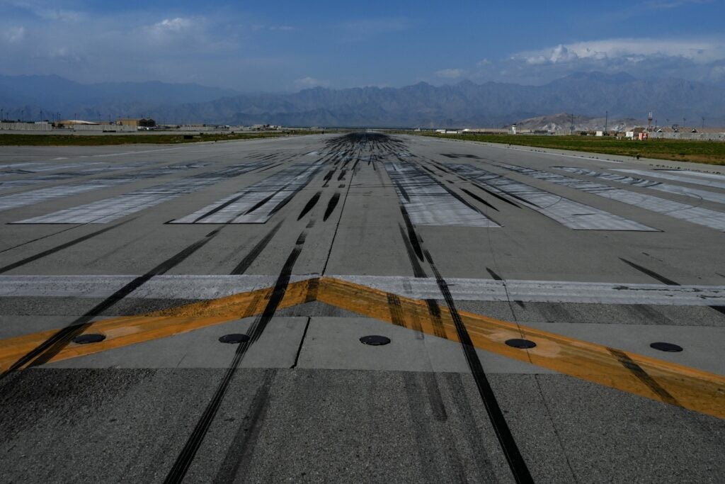 TOPSHOT - General view of the runway tarmac inside the Bagram US air base after all US and NATO troops left, some 70 Kms north of Kabul on July 5, 2021. (Photo by WAKIL KOHSAR / AFP) (Photo by WAKIL KOHSAR/AFP via Getty Images)