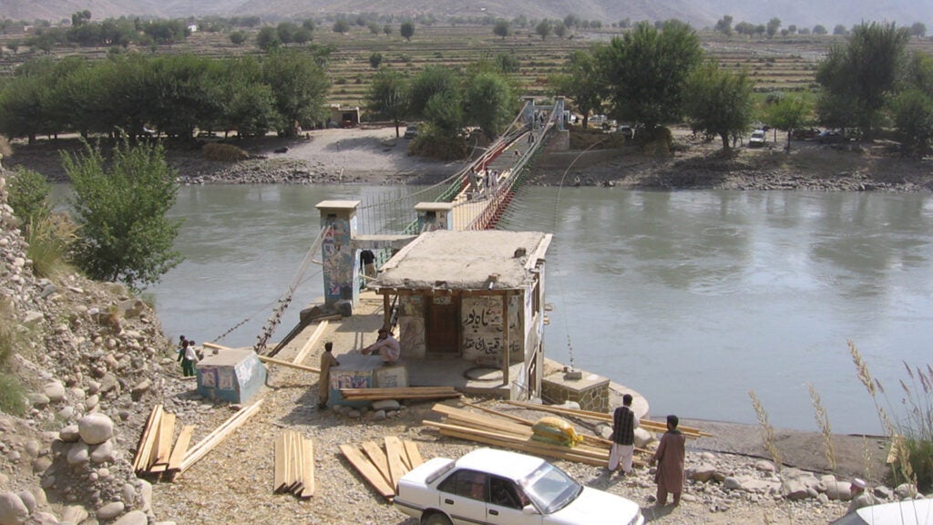 Members of PRT Kunar prepare to examine a bridge under construction in Marawara District, Kunar Province, in 2005. (Photo by Harold Ingram)