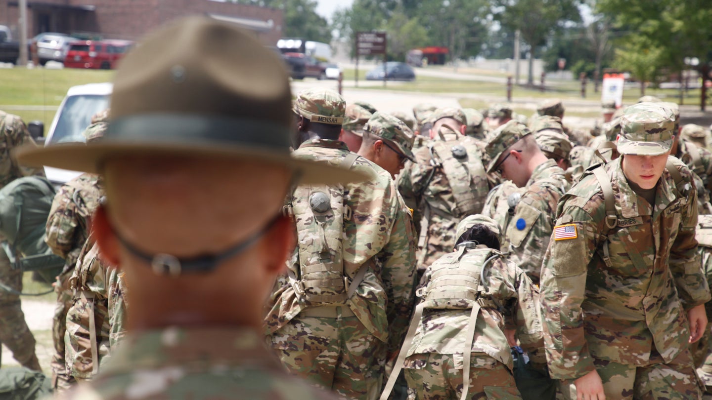U.S. Army Drill Sergeant assigned to Foxtrot 1st Battalion 34th Infantry Regiment watch over trainees as they recover their gear on the first day of Basic Combat Training on 12 June 2017 at Fort Jackson, SC. (U.S. Army/Spc. Madelyn Hancock/Released).