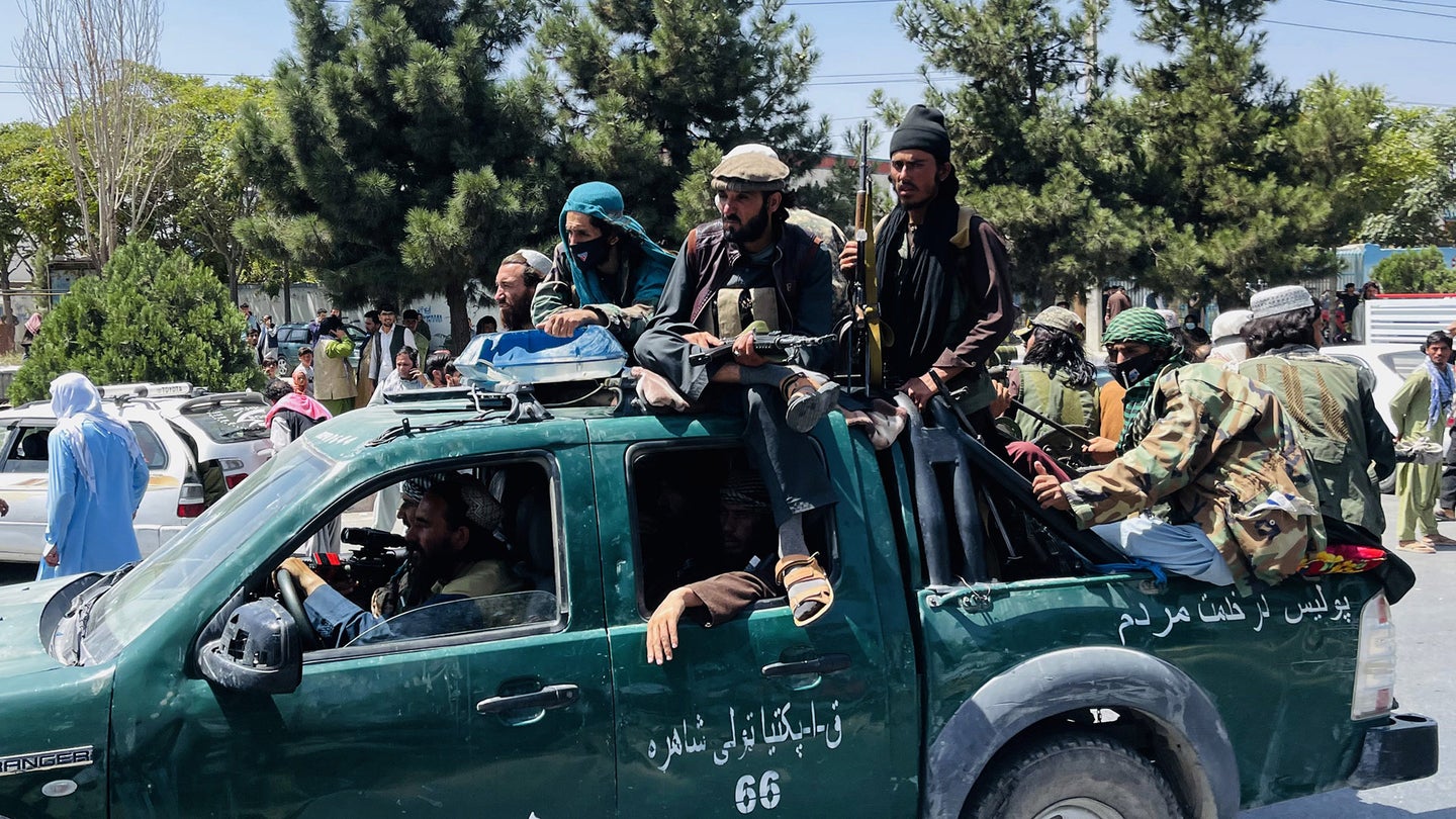 KABUL, AFGHANISTAN-AUGUST 16: Taliban members are seen near Hamid Karzai International Airport as thousands of Afghans rush to flee the Afghan capital of Kabul, Afghanistan, on August 16, 2021. (Photo by Haroon Sabawoon/Anadolu Agency via Getty Images)