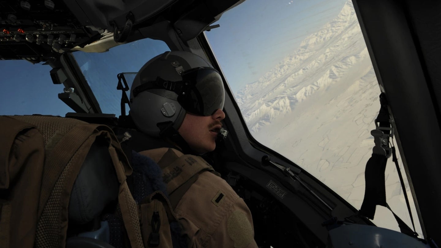 1st Lt. Zach Coburn, a C-17 Globemaster III pilot with the 816th Expeditionary Airlift Squadron, scans the horizon during a mission over Afghanistan on Feb. 14, 2009 in support of Operation Enduring Freedom. (Air Force photo / Staff Sgt. James L Harper Jr.)