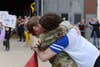U.S. Army Sgt. Sara Lind with the 67th Forward Resuscitative Surgical Team hugs her wife Shelly after returning from Operation Inherent Resolve on August 3, 2021 at Rhine Ordnance Barracks, Kaiserslautern, Germany. The unit was deployed to Syria for nine months and provided emergency resuscitation and surgical support forward of hospital assets to critically injured coalition forces. (U.S. Army photo by Elisabeth Paqué)