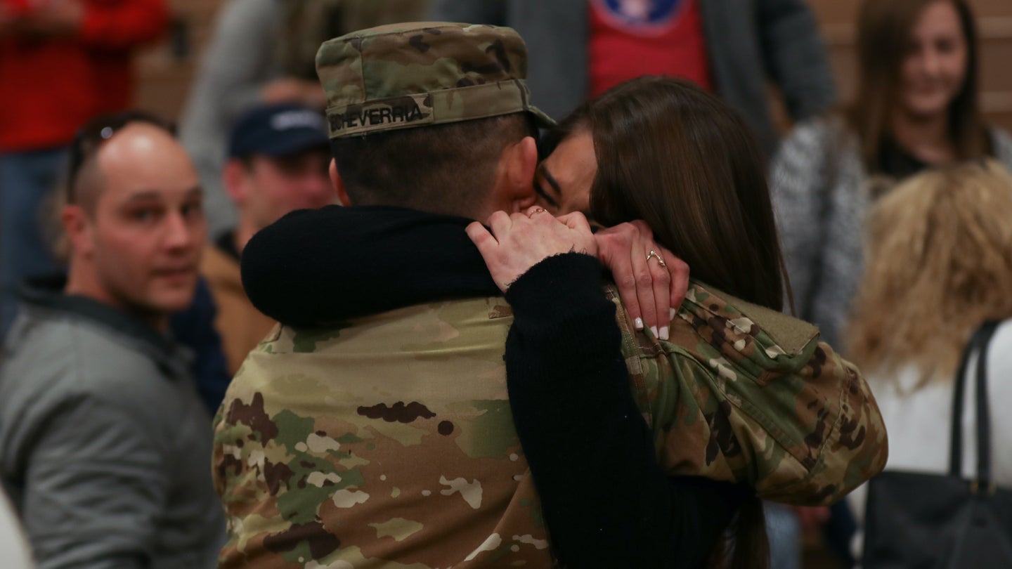 A soldier is reunited with his fiancé during a homecoming ceremony. (U.S. Army/Sgt. Daphney Black)