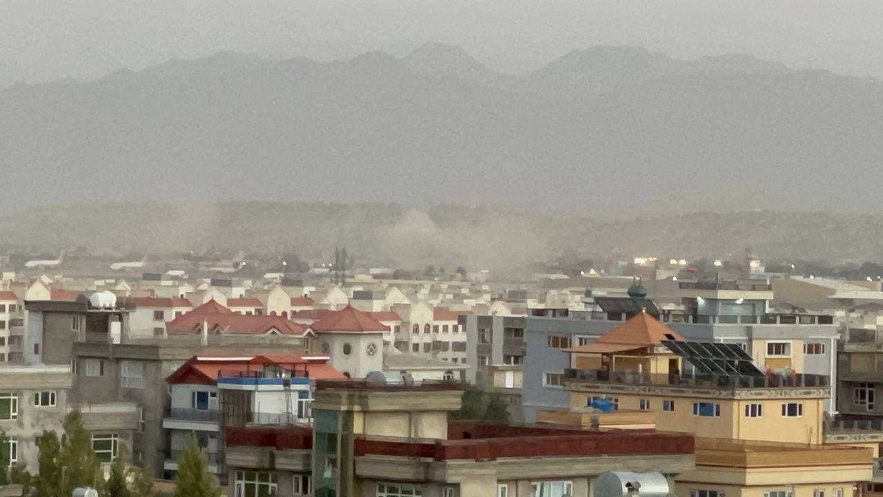 Smoke rises after two explosions reported outside Hamid Karzai International Airport, the center of evacuation efforts from Afghanistan since the Taliban took over in Kabul, Afghanistan on August 26, 2021. (Photo by Haroon Sabawoon/Anadolu Agency via Getty Images)